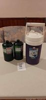 Overall lot with two propane cylinders and Igloo jug