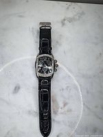 Front view of watch showing dial, bezel, and full strap