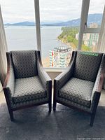 Front view of both matching armchairs showing overall design and fabric