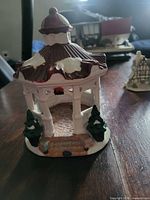 Front view of ceramic gazebo with snow detail and evergreens