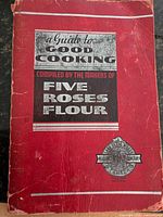 Front cover of red Five Roses cookbook showing wear