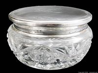 Side view showing full jar, cut glass pattern and sterling lid hallmark "BIRKS STERLING"