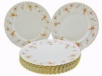Stack of eight Peach Rose dinner plates showing quantity and rim pattern