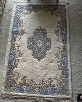 Full view of Aubusson-style rug showing pattern and size