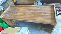 Top view showing woodgrain veneer surface and overall bench form