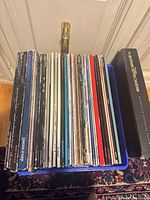 Crate holding spine-visible LaserDiscs showing quantity and sleeve condition