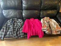 Front view of three jackets laid out