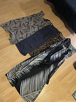 Four dresses laid out together for overview