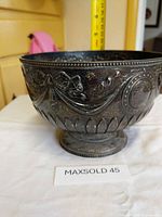 Full side view of silver-plated compote showing overall form and decoration