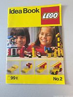 Front cover showing title, LEGO logo, children with models