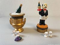 Champagne bucket and waiter trinket boxes with goblets and grape cluster displayed
