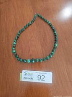 Full view of graduated malachite bead necklace