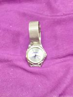 Front view of Arnone watch on purple background
