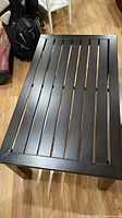 Top view of espresso slatted metal coffee table