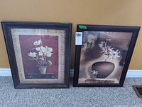 Both framed floral prints side by side