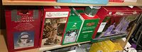 All four boxed decorations on shelf