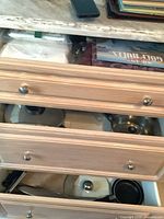 Drawer view showing multiple pans and lids in place