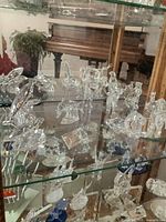 Crystal animals displayed in glass cabinet