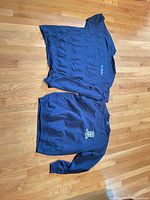 Both tops laid flat showing overall colours and styles