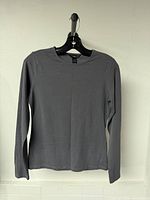 Front view of grey H&M long-sleeve top on hanger