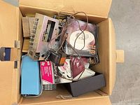Top view of box showing stereo unit, adapter, boxed items