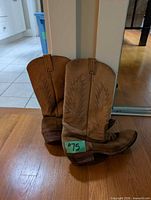 Side view of both boots standing upright