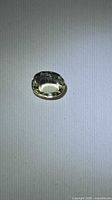 Front view of oval yellow scapolite