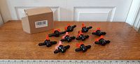 Group of ten valves and box on table