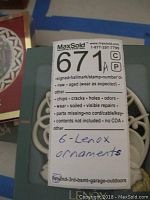 Photo of six Lenox ornaments packaging label with handwritten note indicating '6 - Lenox ornaments'