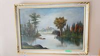 Full view of framed landscape painting