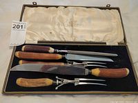 Open case showing all utensils and antler handles