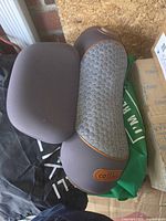 Top view of grey traction pillow showing honeycomb texture and brown trim