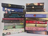 Left-side stack of 11 novels showing spines