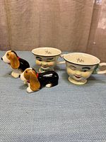 Overall lot showing both Baileys mugs and two dog shakers