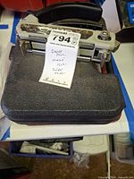 CAMO Marksman Pro deck tool resting on Weller soldering gun case with lot label visible