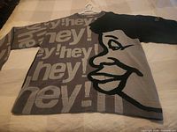 Full front view of sweater showing overall graphic design
