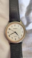 Front view showing dial, case and strap