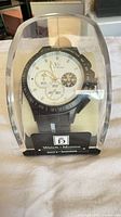 Watch in sealed plastic display case showing full item