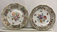 Top view of both Dresden porcelain pieces showing floral design and reticulated rims