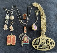 Full view of all jewellery pieces arranged on black background