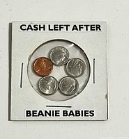 front view of coin flip showing five miniature coins and printed text