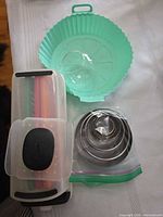 Overall view showing collapsible bowl, cookie cutter set, mandolin slicer in case