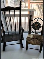 Both miniature chairs side by side on windowsill