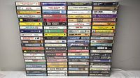 Full front view of all 100 cassette tapes stacked in eight vertical rows