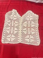 Front view of crochet panel showing twin cross motif