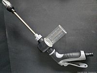 Full view of garden hose sprayer showing wand, grip, soap reservoir and nozzle