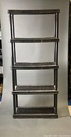 Full frontal view of five-tier shelving unit