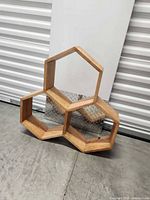 Front view of three-hexagon wood shelf