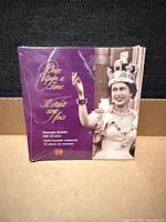 Front of shrink-wrapped booklet showing Queen Elizabeth II and title text