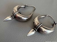 Pair of 925 silver crescent hoop earrings with pointed finials